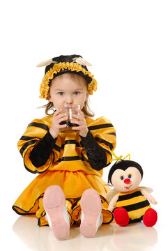 The little girl with a honey glass