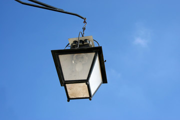 Fototapeta na wymiar european street lamp over a blue sky