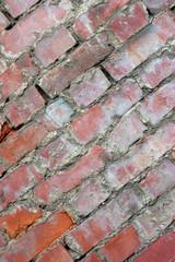 diagonal perspective of old decaying brick wall