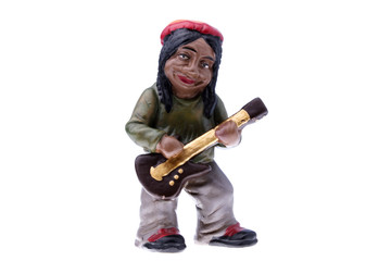 Rastaman statuette playing bass