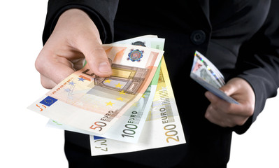Hand giving Euro banknotes of 50, 100 and 200 Euro