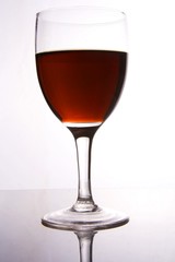 A glass of red wine in white background.
