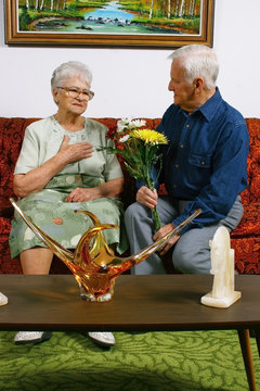 Senior Woman Receiving Flowers