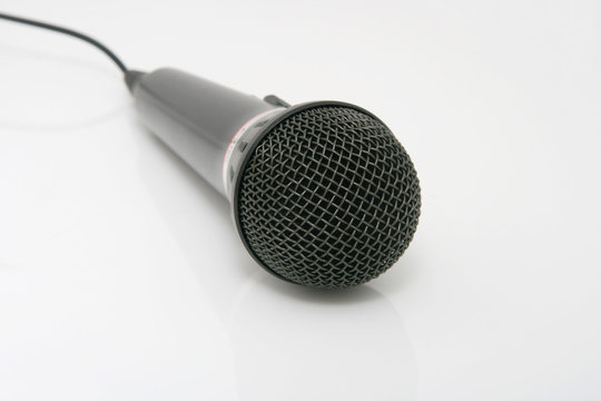 Black cylindrical microphone on a white background.