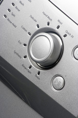 Close up of a washing machine knob / dial