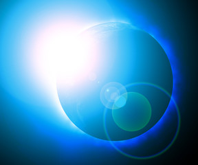 Rising sun behind planet earth