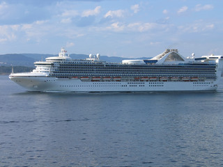 Fototapeta na wymiar Big cruise ships sailing between the fjords in Norway