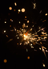 sparking Bengal fire in the dark, close-up