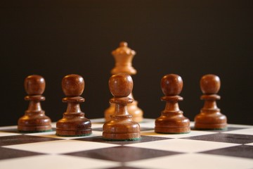 chess queen and pawns