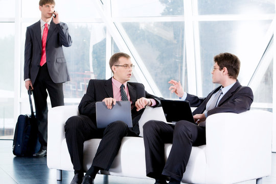 Image of different business negotiations in a office building