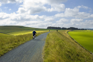 Fototapeta na wymiar Cyclists on the Tissington trail cycleway 