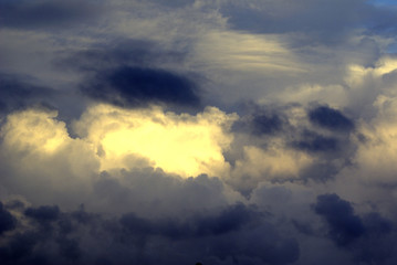 Naklejka na ściany i meble Dramatic clouds with light