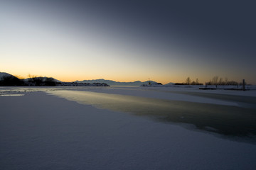 Sunrise over the Frozen Lake in Winter