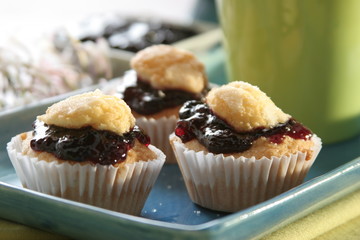 Madelaines stuffed with backberries marmalade, close up