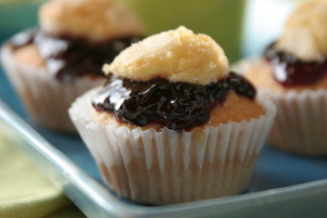 Madelaines stuffed with backberries marmalade, close up