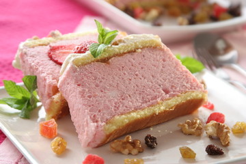 Recipe of cold strawberries mousse dessert, with nuts and grapes