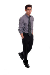 A young businessman walking with hands in pockets
