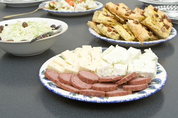 plates with freshly cooked food placed on a table