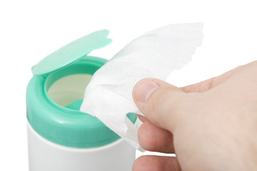 taking wipes from a dispenser isolated against white background