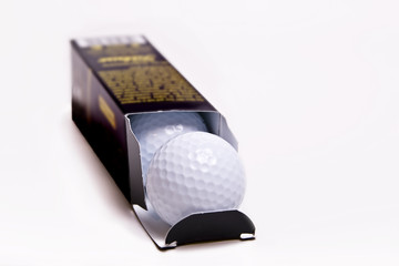 Box of new premium golf balls.