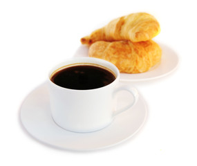 Breakfast of black coffee and fresh croissants 