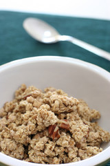 Bowl of crumbly wheat and corn cereal with nutty bits