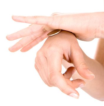  hands playing game with coin on a white background