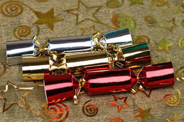 Chocolate Christmas crackers on a tablecloth 