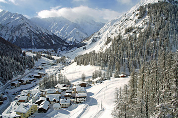 little village between high mountains in winter