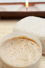 Relaxing spa scene with nourishing and exfoliating scrub