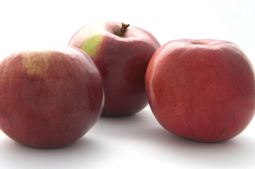 Three red apples