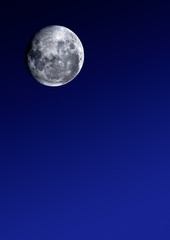 Full moon image, on graduated blue background