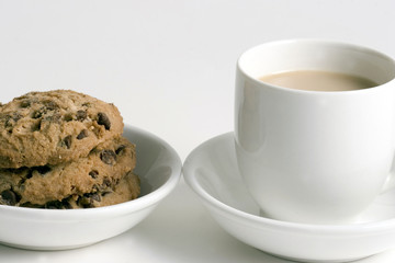 Coffee And Stack Of Chocolate Chips Cookies