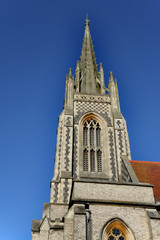Fototapeta na wymiar English Town Church Steeple against a clear blue Winter sky
