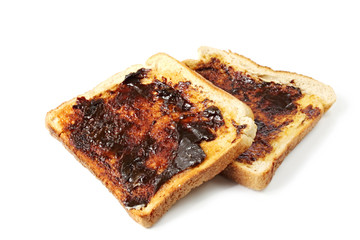 Vegemite on toast, an Australian icon.  Isolated on white.