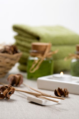 Aromatherapy products and candles on table