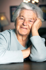 Elderly woman smiling at the camera