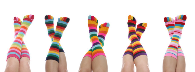 Five women with colorful rainbow striped socks