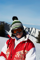 Fototapeta na wymiar Portrait happy ski girl in red