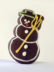 funny honey-cake chocolate iced like snow-man  
