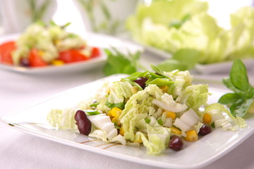 Fresh salad with corn and basil