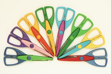 Colorful craft scissors on a white background