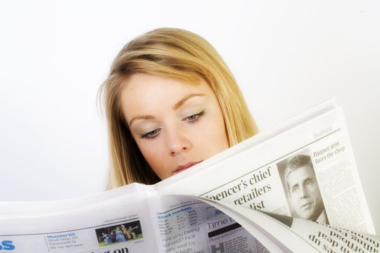 Girl reading the paper