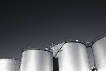 refinery oil tanks in dark light
