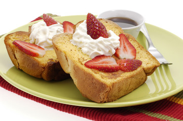 Delicious french toast with strawberries and whipped cream.