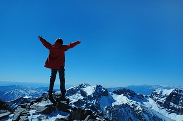 Girl over a snowcapped peaks.