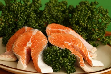 Salmon fillets on the plate with parsley