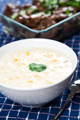 A shot of creamy corn soup on a banquet