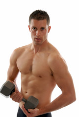 A muscular fit man lifting dumbells