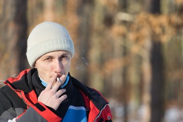 Man smoking in a winter day
